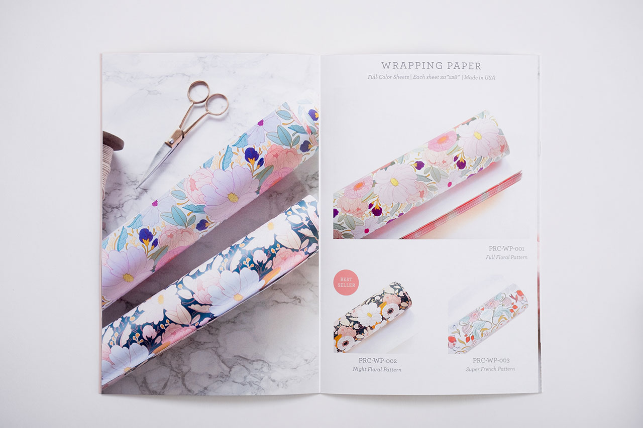 A marketing catalog laying open to wrapping paper products and details.