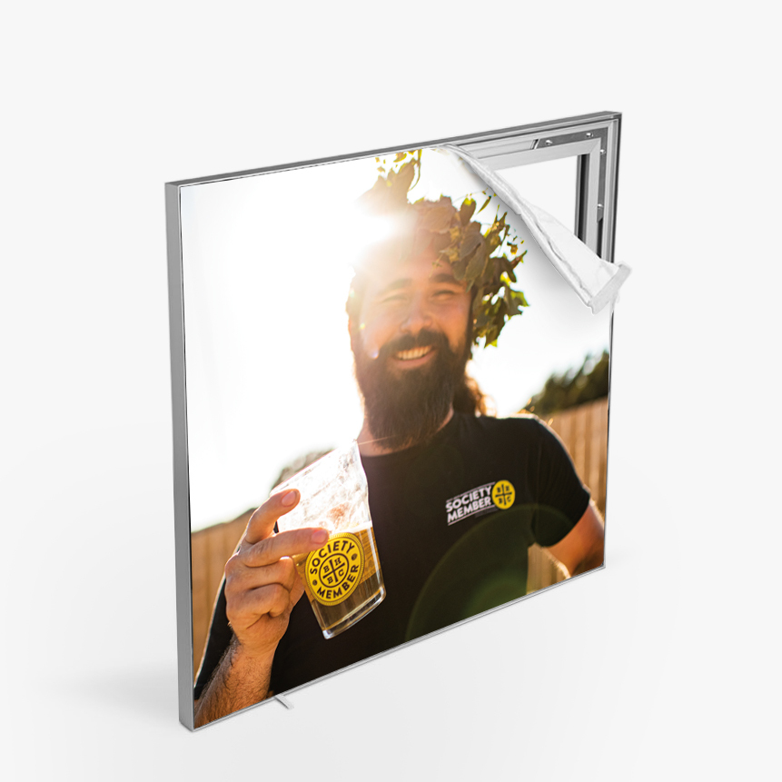 An SEG with an image of a smiling man holding a beer.