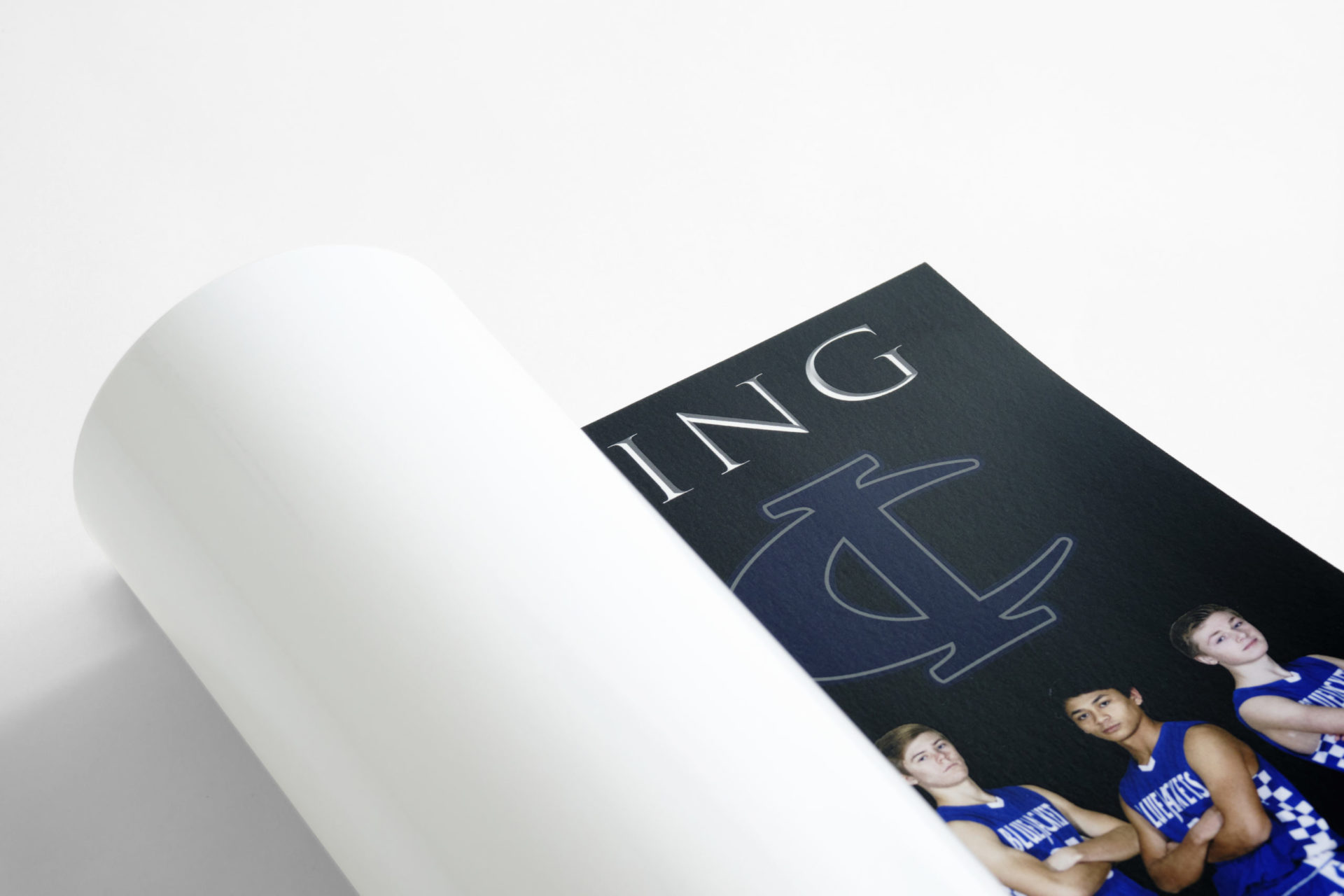 A custom poster printed with a basketball team and a black, white and blue design.