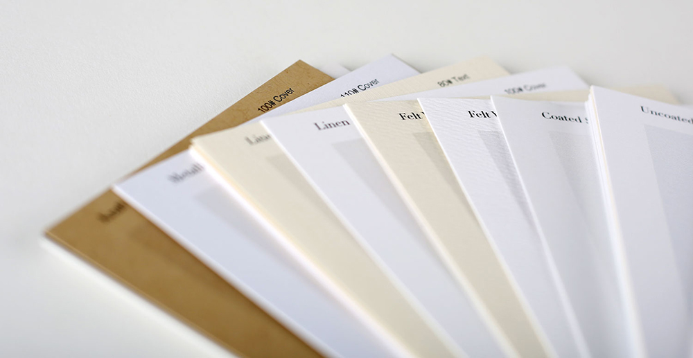 A stack of fanned-out paper samples with their names printed at the top.