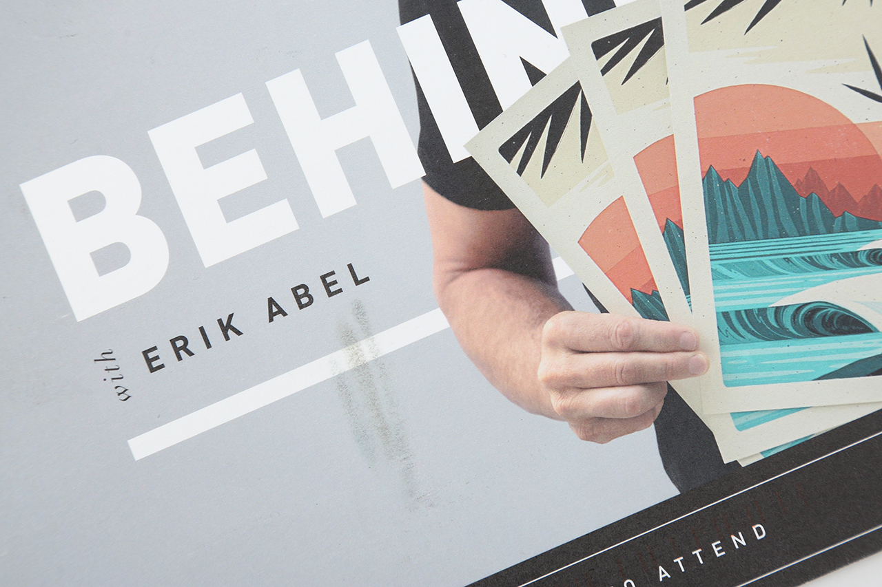 A marketing postcard printed with a man holding posters and Behind the Print With Erik Abel.