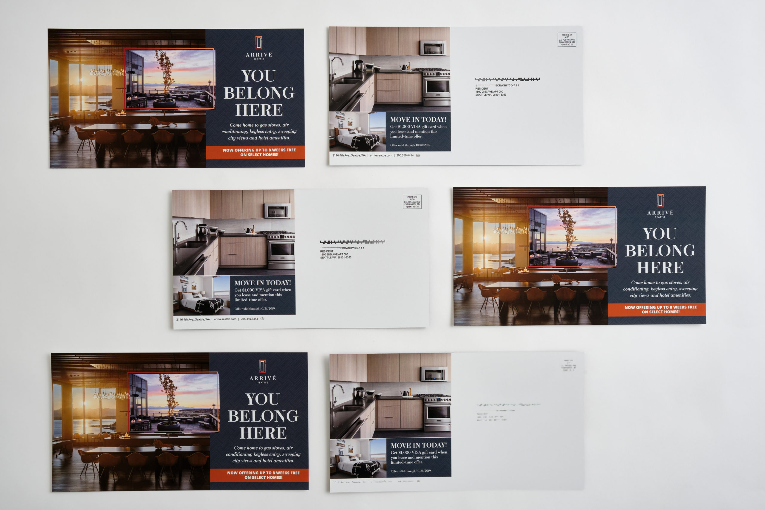 Six direct mail postcards printed with images of apartments.