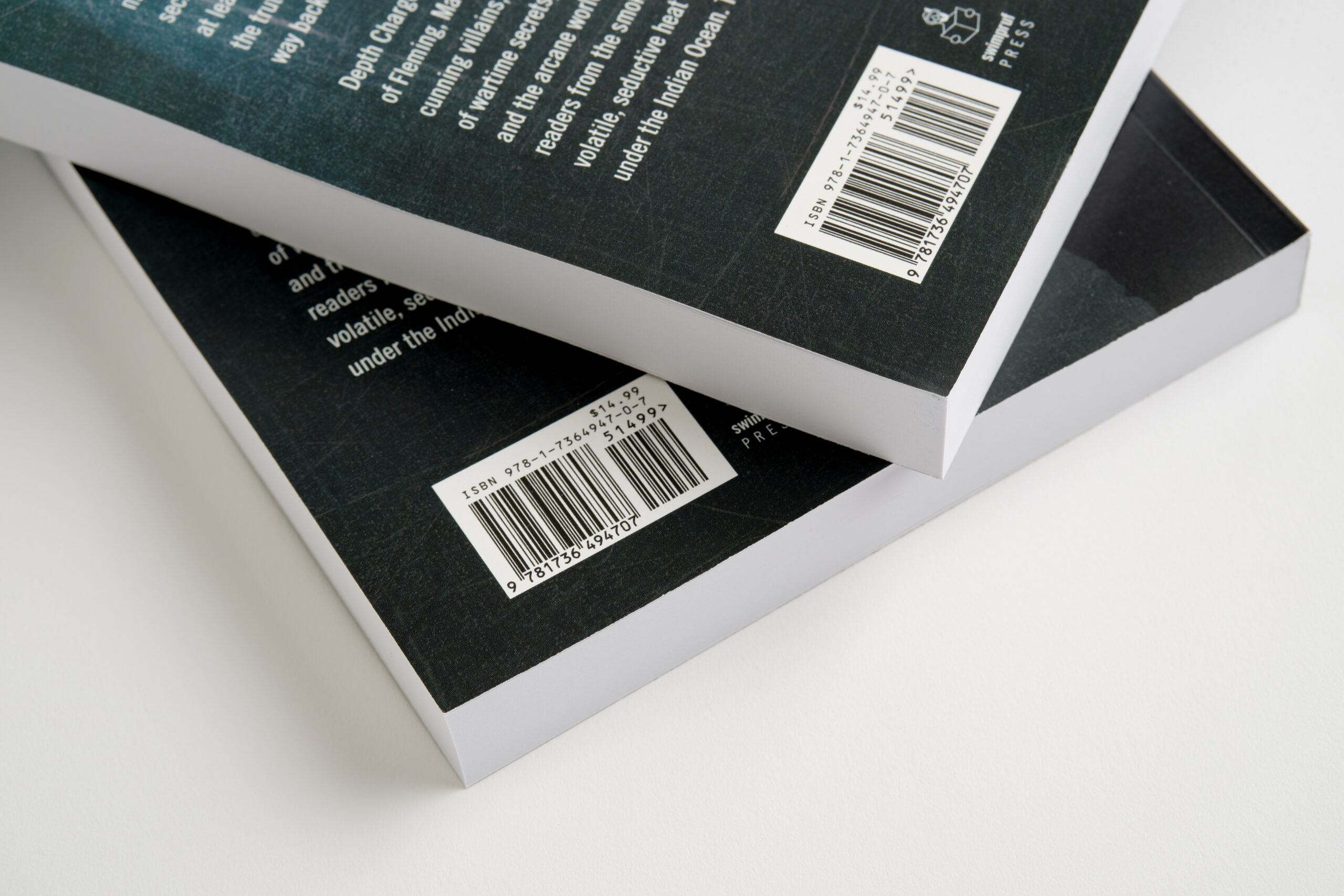 Two paperback books stacked on top of each other and printed with ISBN numbers in the bottom corner.